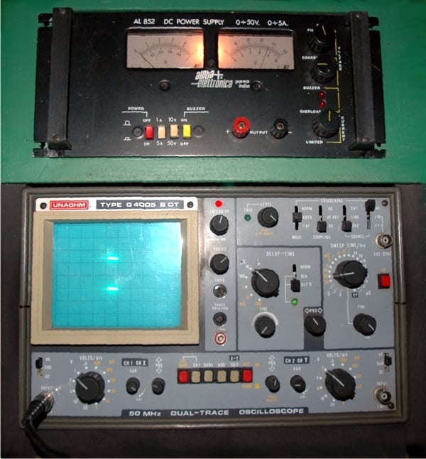 Unahom dual trace oscilloscope and Alpha Elettronica power supply for the development of data acquisition cards for the large Casalvento distillery