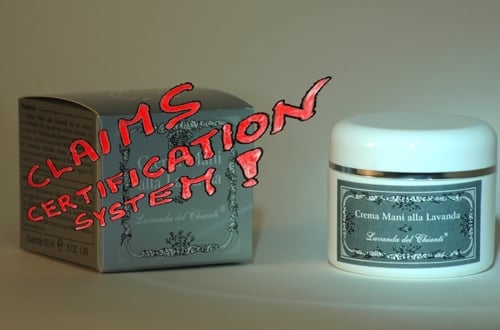 White plastic jar of Lavender Hand Cream with silver label on the right, silver box on the left with superimposed Cistama certification Claims ! light brown background