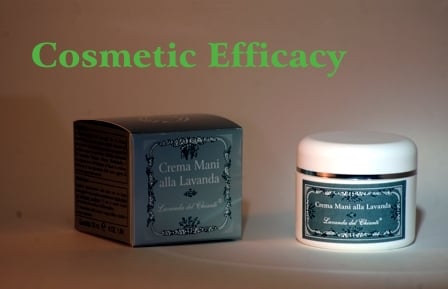 White jar of hand cream with gray label and silver box on tan background with cosmetic effectiveness written